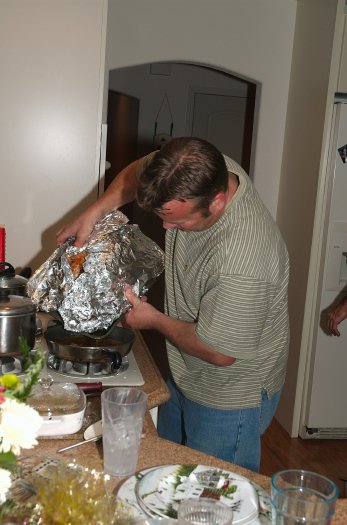 John Schureman fixing turkey for Xmas dinner 12-25-04