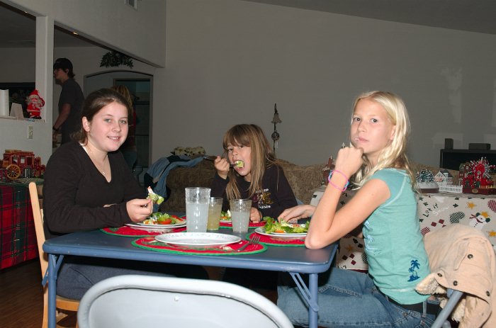 Kelly Katey and Haley eating Xmas dinner at Schuremans 12-25-04