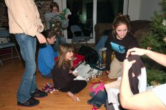 Cousins opeining gifts at Schuremans in Cameron Park 12-25-04